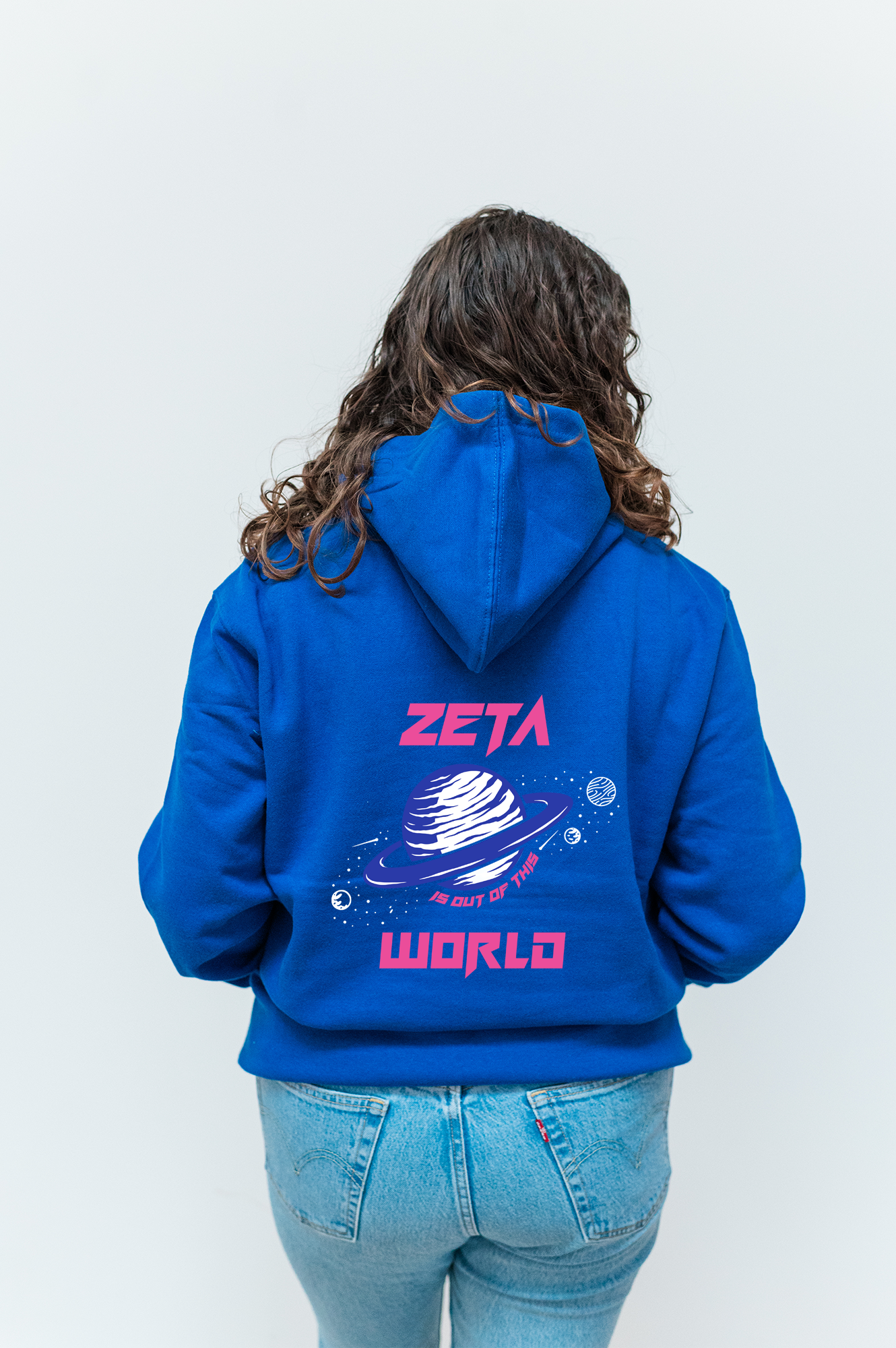 a woman wearing a blue hoodie with the word zeta on it