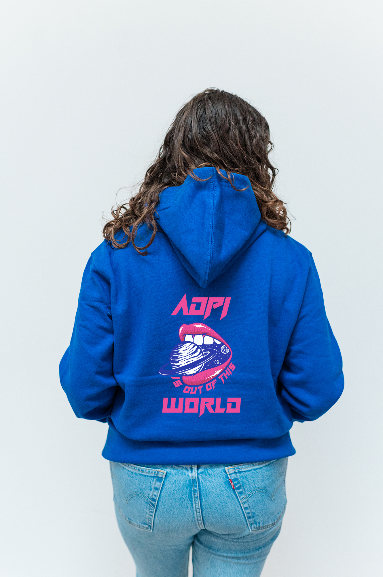 the back of a woman wearing a blue hoodie