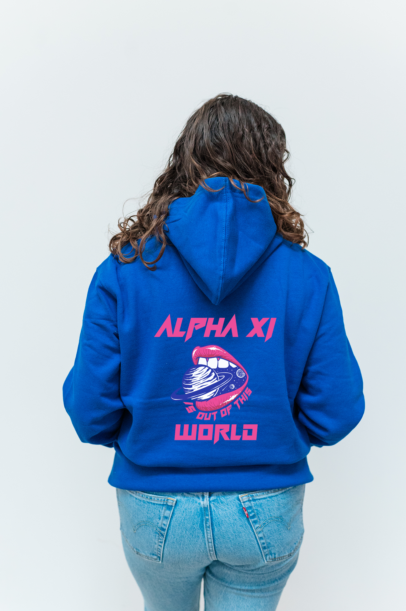 a woman wearing a blue hoodie with the words alpha xi on it