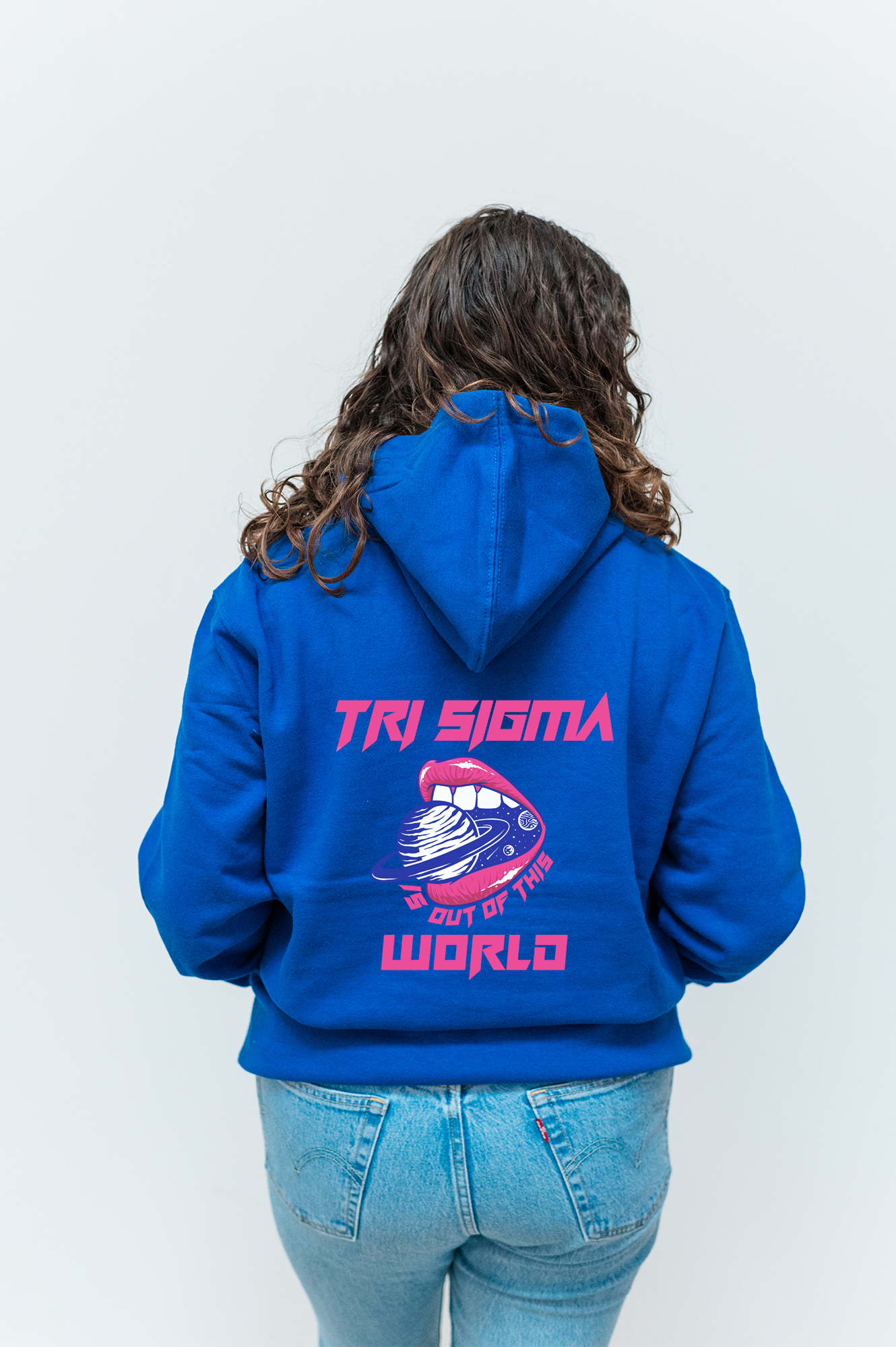 a woman wearing a blue hoodie with a picture of a fish on it